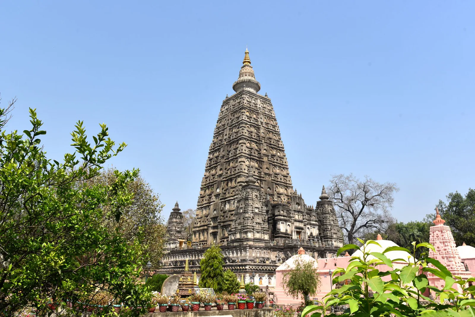 The majestic Mahabodhi Temple in Bodhgaya surrounded by lush greenery – Varanasi & Bodhgaya: Sacred Heart of India