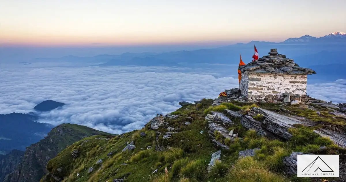 Temple at the Chandrashila summit surrounded by Himalayan peaks