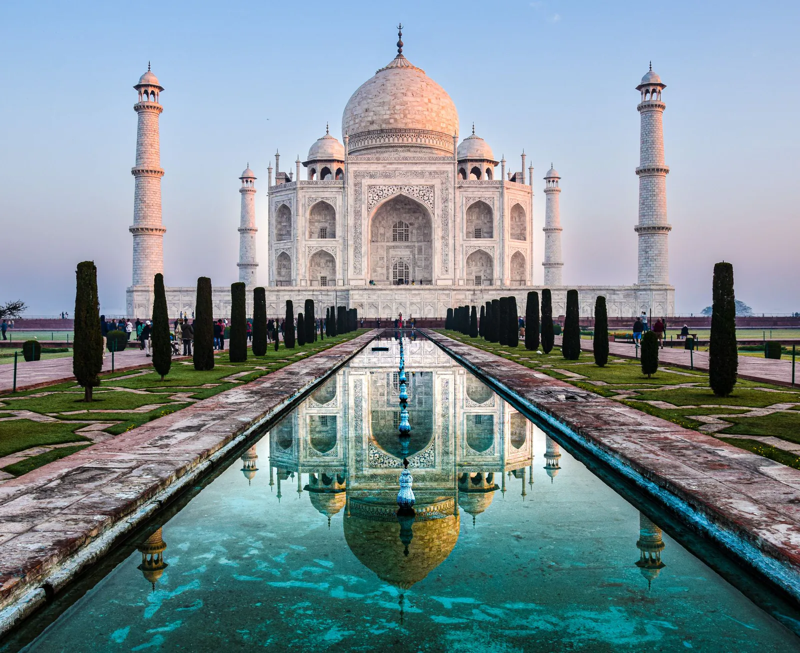 Spectacular view of the Taj Mahal reflected in the Yamuna River at sunrise in Agra, India