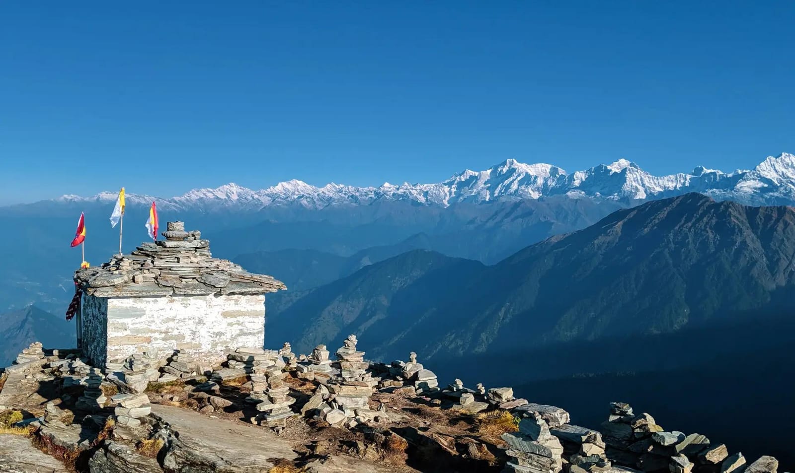 The Himalayan Awakening — mountain shrine in the Himalayas with snow-capped peaks
