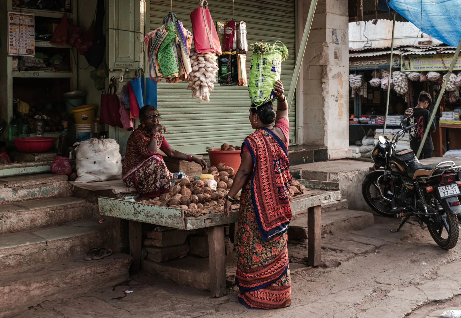 Traveler connecting with a local vendor at a traditional Indian market
