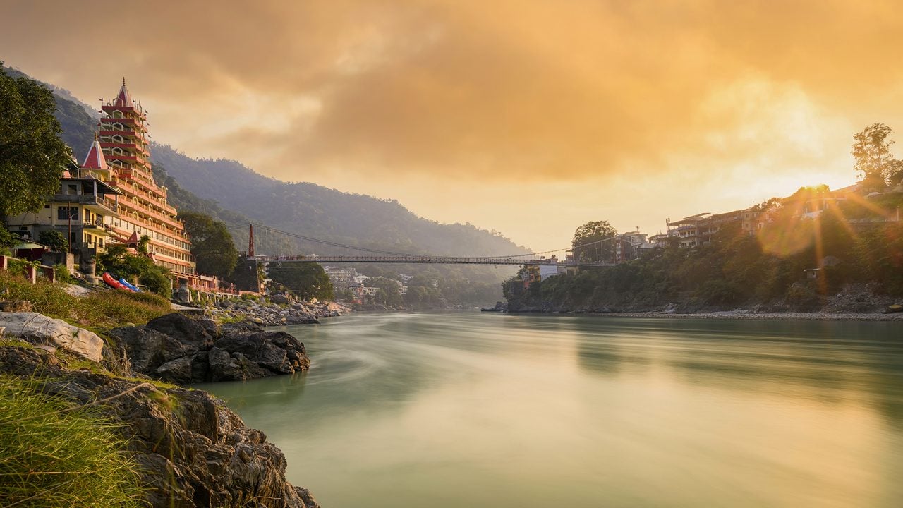 Rishikesh Yoga &amp; Spiritual Retreat — sunset over the Ganges river in Rishikesh