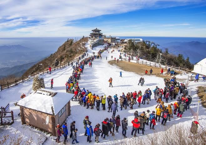 Himalaya Yoga Retreat — snow-capped Himalayan peak with visitors