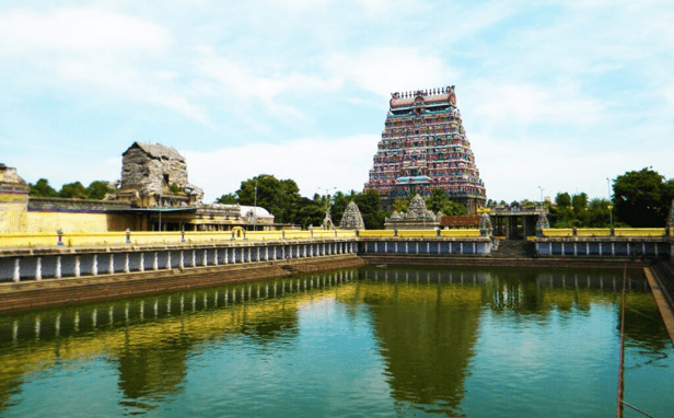 Sacred temple water tank with gopuram reflection in Tamil Nadu
