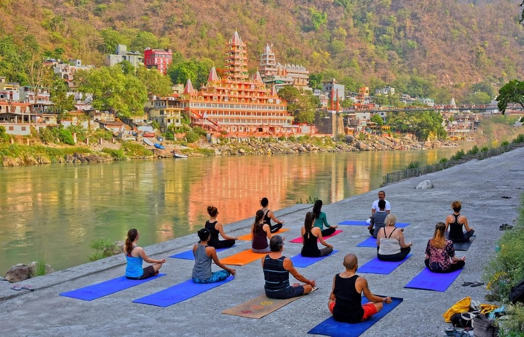 Yoga class by the riverside in India